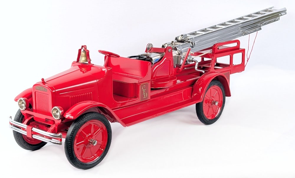 Restored Buddy L Aerial Ladder Fire Truck with Rubber Tires: Professionally restored Buddy L aerial ladder fire truck. The truck is the deluxe version with rubber tires, headlights, and chrome bumper. A very high quality professional restoration. Excellent