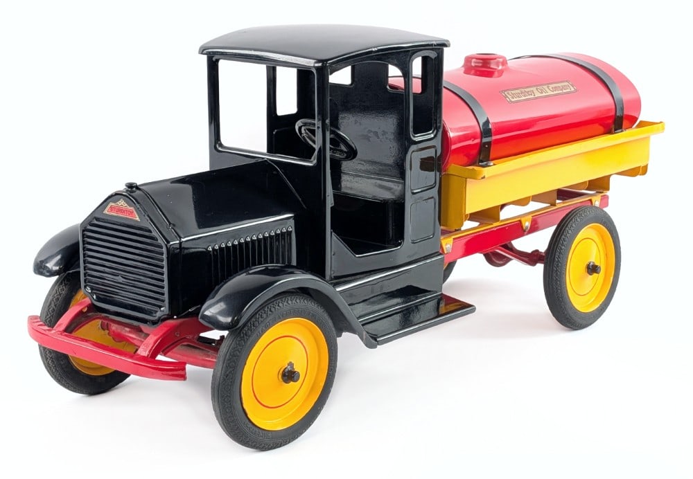 Restored Sturditoy Oil Company Tanker Truck: Restored Sturditoy Oil Company tanker truck. The truck has an older restoration, but is fairly well done. It does show some crazing to the red tank, and a couple small paint chips. It is missing the l