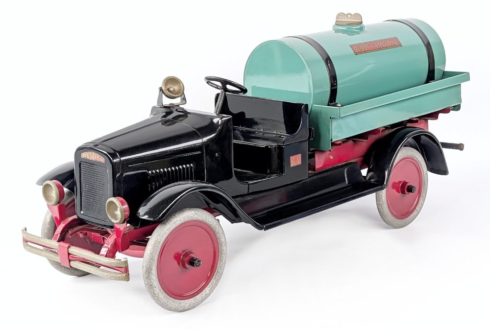 Restored Buddy L Pressurized Tank Line Sprinkler Truck: Restored Buddy L pressurized tank line sprinkler truck. The truck has a quality older restoration. It does show some oxidation to the headlights, spotlight, and bumper. A nice restoration done to a ha