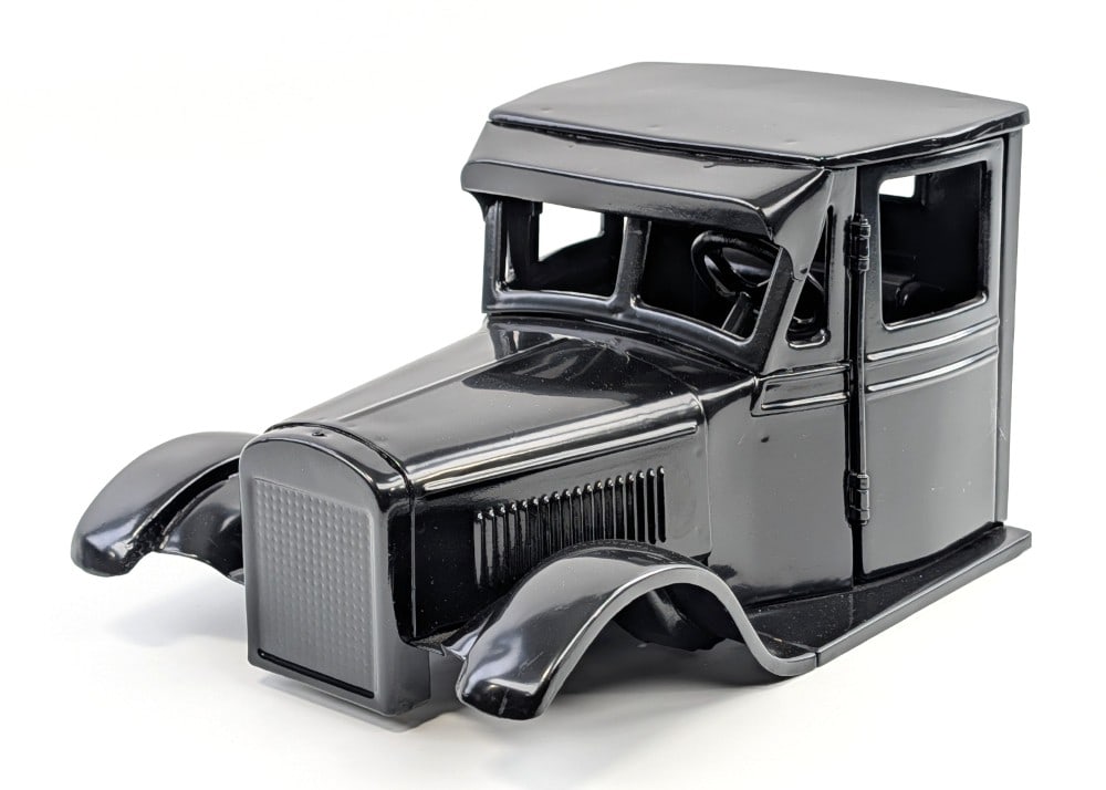 Restored Buddy L Junior Truck Cab: Restored Buddy L Junior truck cab. The cab has opening doors and has the steering wheel. It is missing the radiator cap. Good for completing a restoration or a custom project. Overall measures approxi