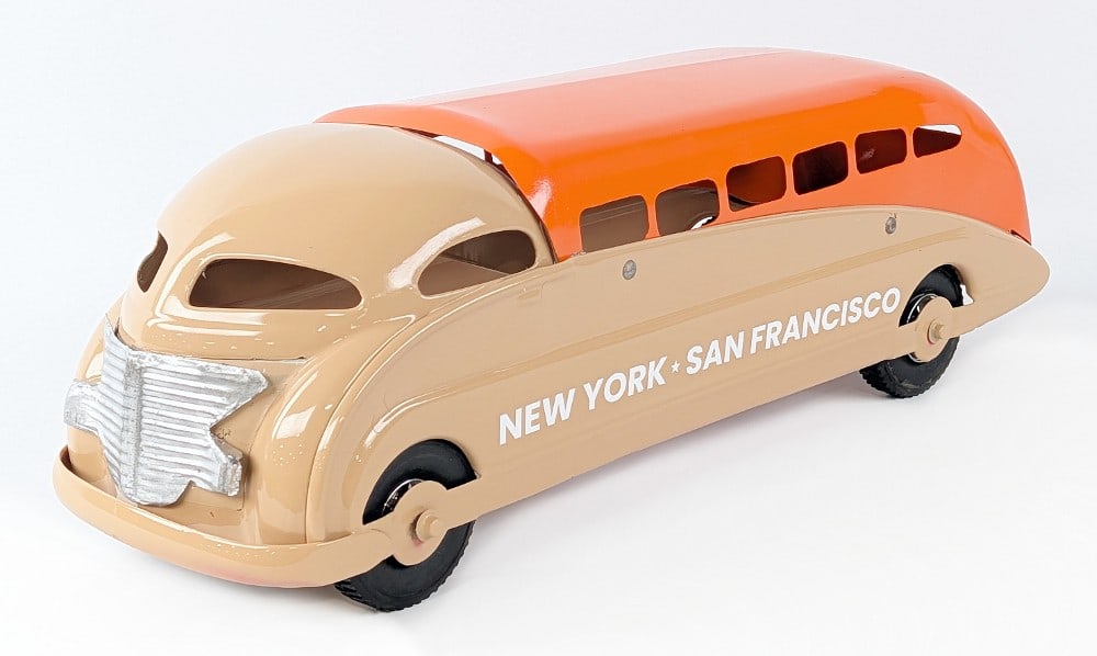 Steelcraft New York - San Francisco Streamline Bus: Steelcraft New York - San Francisco streamline bus. The bus has a replacement grill and custom tire / wheels. A somewhat amateur paint job with run marks showing. Still a harder to find toy in any con