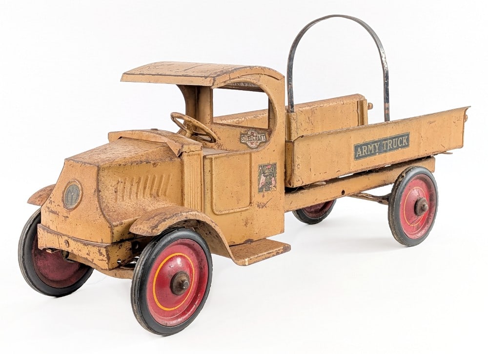 Original Steelcraft Mack Army Truck: Original Steelcraft Mack Army Truck. The truck has a "C" style mack cab. It is missing the canvas top and rear tailgate. The truck displays well with great patina. It still has the original Mack + Arm