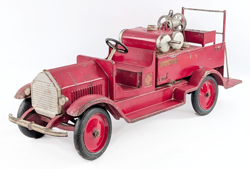 Sturditoy American LaFrance Pumper Fire Truck: Sturditoy American LaFrance pumper fire truck. The truck has some old overpaint, but the decals are original. It is missing the hoses and has unusual mounted headlights. Overall a straight truck that 