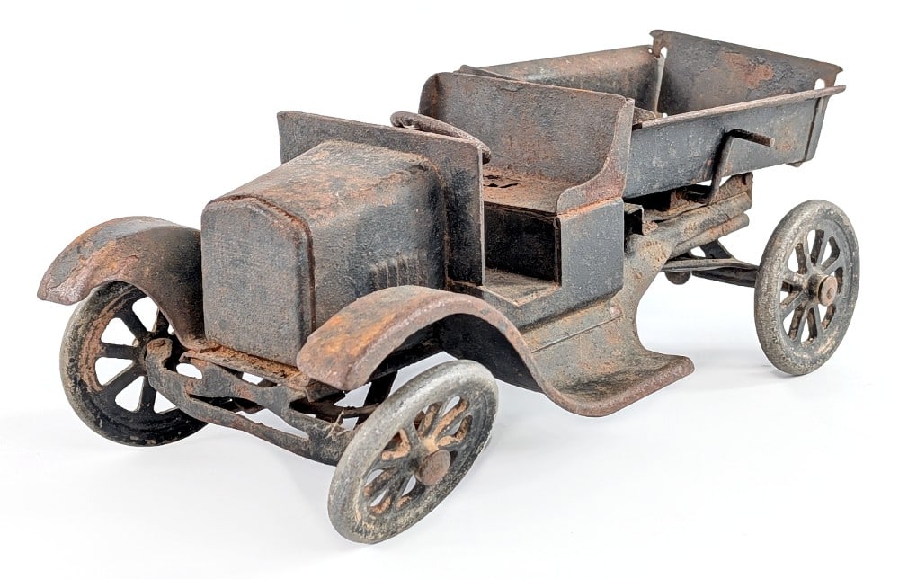 Buddy L Flivver Dump Truck: Buddy L Flivver dump truck. Rough condition with bent wheels, rust damage, and almost no paint. A restoration or custom project candidate. Measures approximately 11" long. *From the Gene Griser Collec