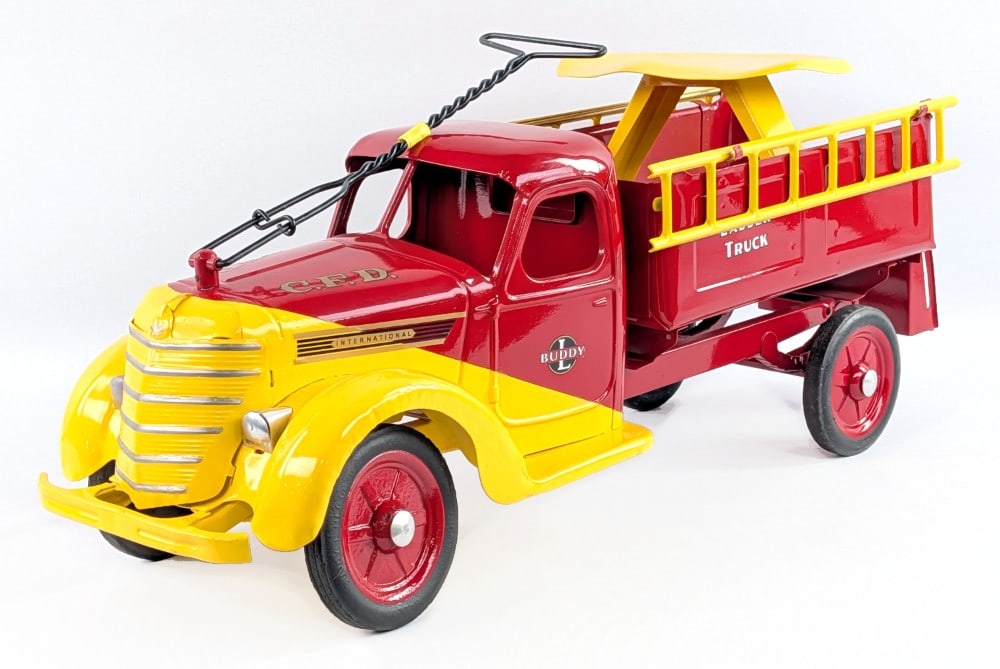 Restored 1938 Buddy L International Ladder Truck: Restored 1938 Buddy L International ladder fire truck. The truck has a very nice restoration. Excellent condition with minor dust and light wear from age. One of the harder to find 1938 International 