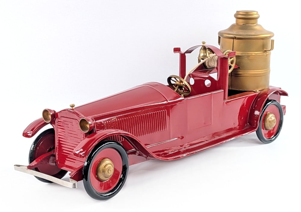 Restored Turner Packard Fire Pumper Truck: Restored Turner Packard fire pumper truck. The truck has a very nice restoration overall. It has a rear friction drive motor that is in working condition. It is missing the ladders. Measures approxima