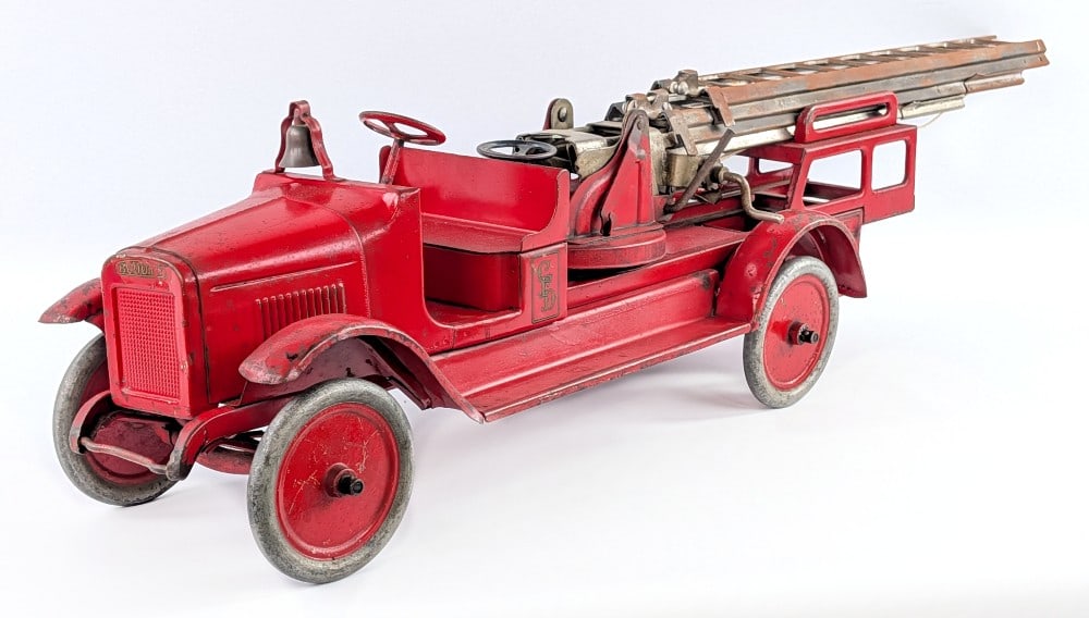 Original Buddy L Aerial Ladder Fire Truck: Original Buddy L aerial ladder fire truck. Hydraulic aerial ladder version. Original condition with good paint and decals. Showing some paint loss and expected wear from age. Displays well with good p