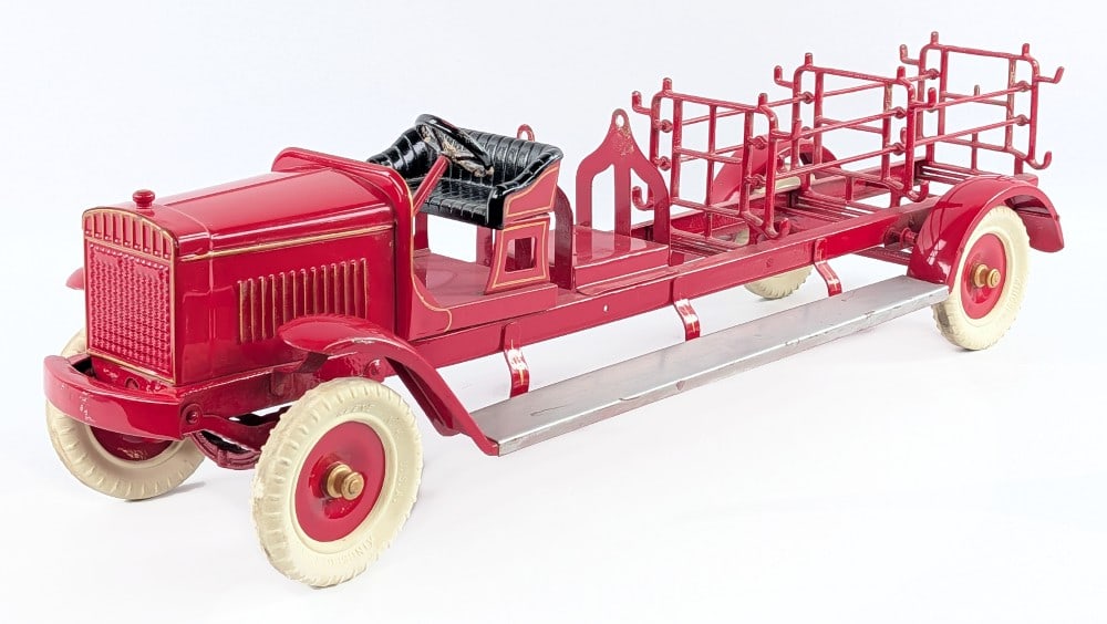 Kingsbury Toys Ladder Fire Truck: Kingsbury Toys ladder fire truck. The truck is missing all of the ladders and aerial lift mechanism. It does have a nice paint job with some small chips, scratches, and dust from display / handling. M