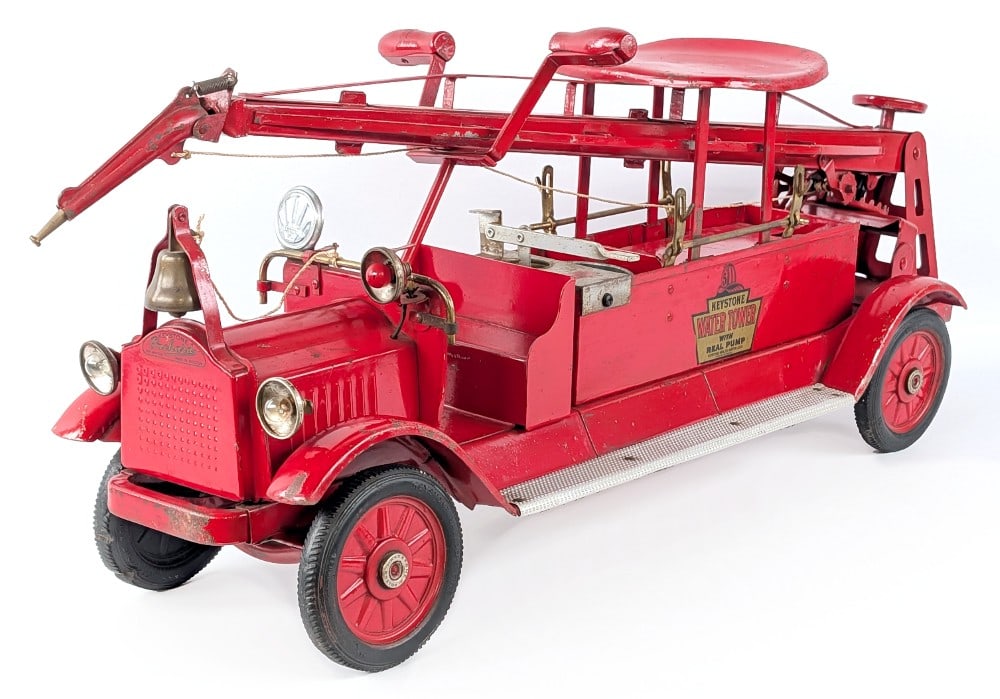 Keystone Packard Water Tower Fire Truck with Real Pump: Keystone Packard water tower fire truck with real pump. Deluxe ride on version with electric headlights, siren light, and siren. It appears to have some old enhancements, but appears original. It is m