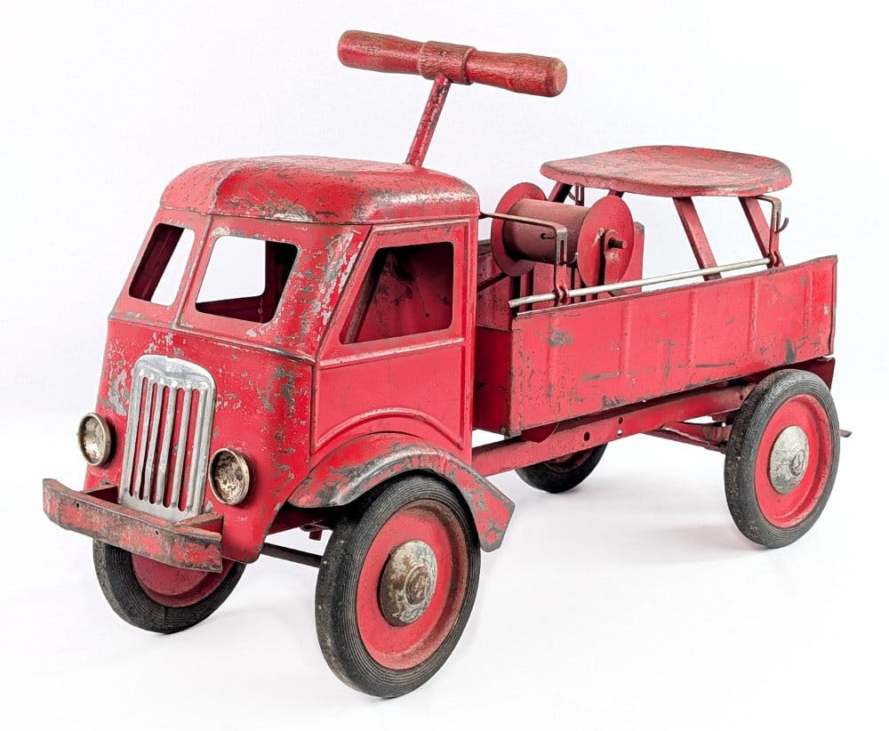 Keystone Ride 'Em Fire Truck: Keystone Ride 'Em fire truck. The truck is missing the ladders and hose. t has paint flaking, paint loss, and wear from play and age. Measures approximatley 26" long. *From the Gene Griser Collection*