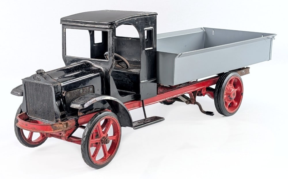 Burdette Murray Dual Wheeled Dump Truck: Partially restored Burdette Murray dual wheeled dump truck. The dump bed and some of the hardware has been restored / replaced. The cab, frame, and wheels appear original with possible older enhanceme