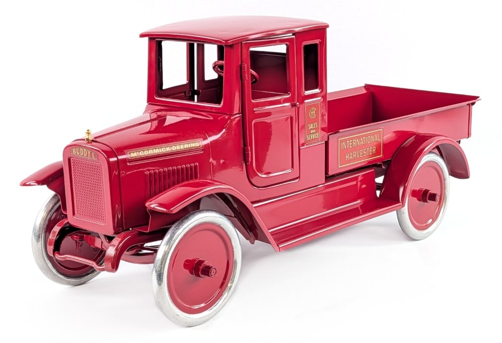 T-Reproductions Buddy L International Harvester Red Baby Truck: T-Reproductions Buddy L International Harvester Red Baby truck. The truck is the doored variation. Very good condition with some dust from display. Measures approximately 24" long. *From the Gene Gris