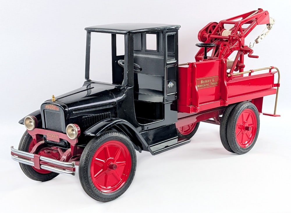 Custom Buddy L Wrecking Tow Truck: Custom Buddy L wrecking tow truck. A nice custom fantasy Buddy L piece with black cab, large rubber tires, deluxe bumper, and red wrecker tow bed. Very good condition with dust from display and some s