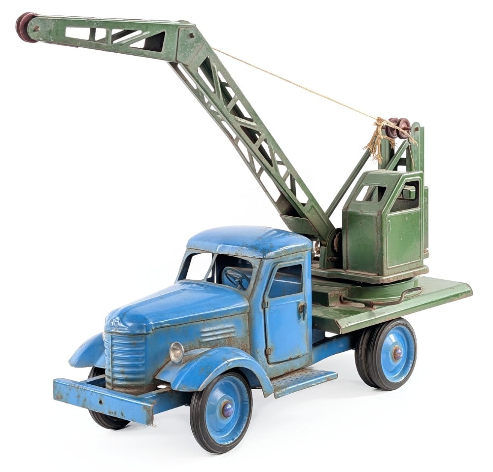 Russian Crane Truck: Russian crane truck. The truck is missing the shovel for the crane. The truck shows some surface rust, paint loss, and wear from age. The doors on the cab open. Measures approximately 21" long. *From 