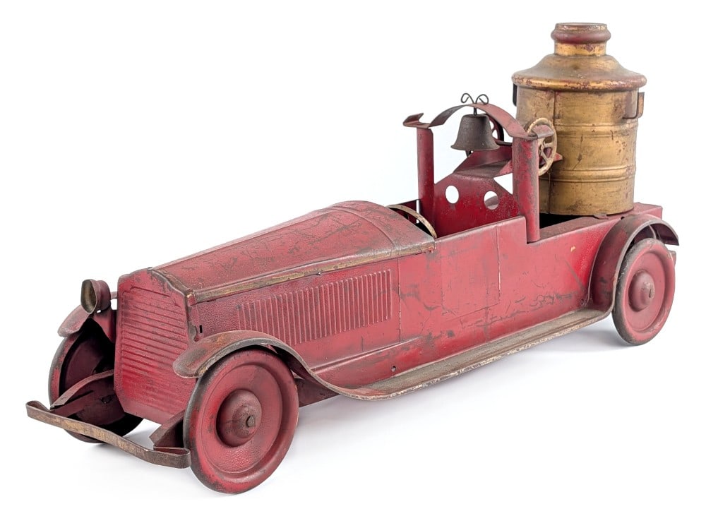 Turner Packard Fire Pumper Truck: Turner Packard Fire Pumper. Original condition missing one headlight, ladders, and the rubber tires. The truck has a working rear friction drive motor. The truck shows some paint loss and expected wea