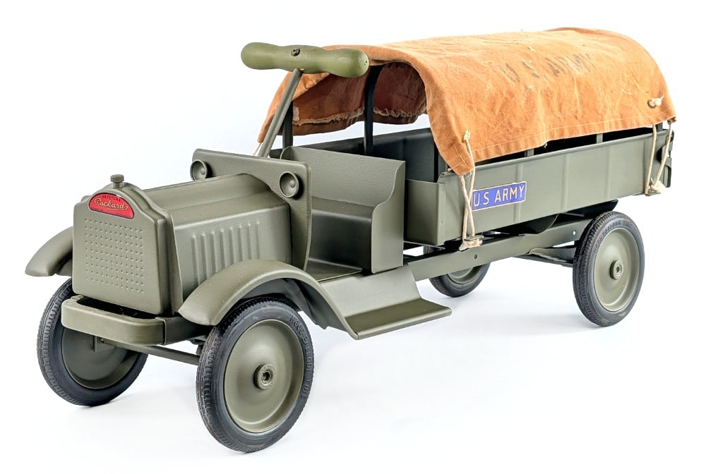Custom Keystone U.S. Army Ride On Truck: Custom Keystone Packard U.S. Army ride on truck. The canvas has some staining and the one decal is peeling. The truck has dust and light wear from display. Very good condition. Measures approximately 