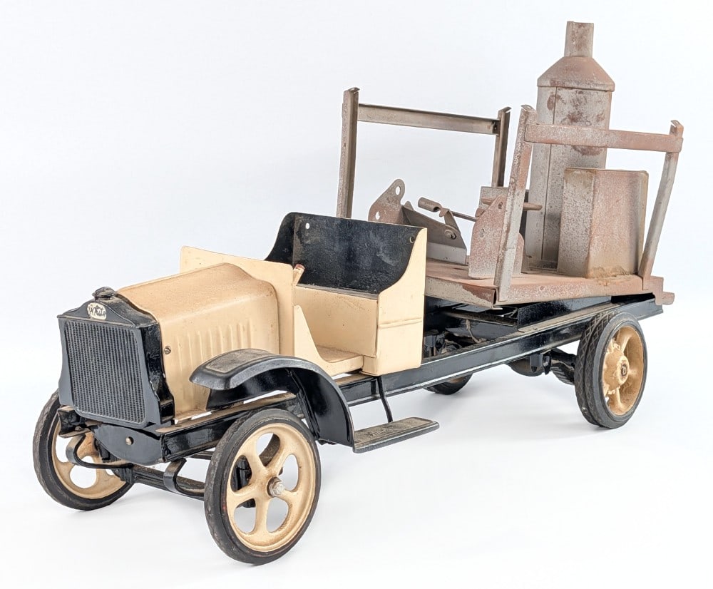 Kelmet White Truck Parts: Kelmet White truck parts. The truck has an old repaint with unpainted steam shovel bed. It is missing the steering wheel, bumper, fender, and parts of the steam shovel. Sells as is. Measures approxima