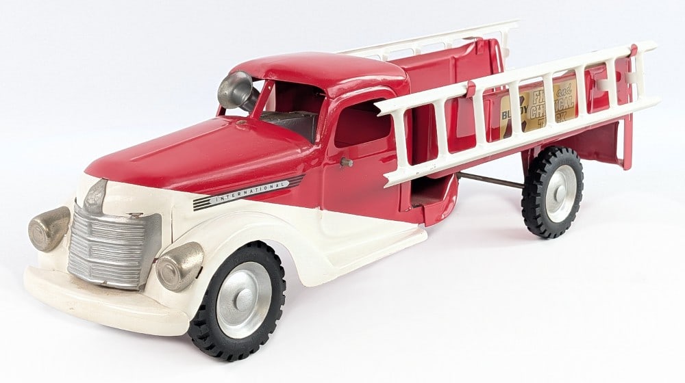 Restored Buddy L Fire and Chemical Truck: Restored Buddy L International fire and chemical truck. Overall a fairly nice restoration with a couple minor chips and light wear from age. The truck has a siren, ladders, and pump. Measures approxim