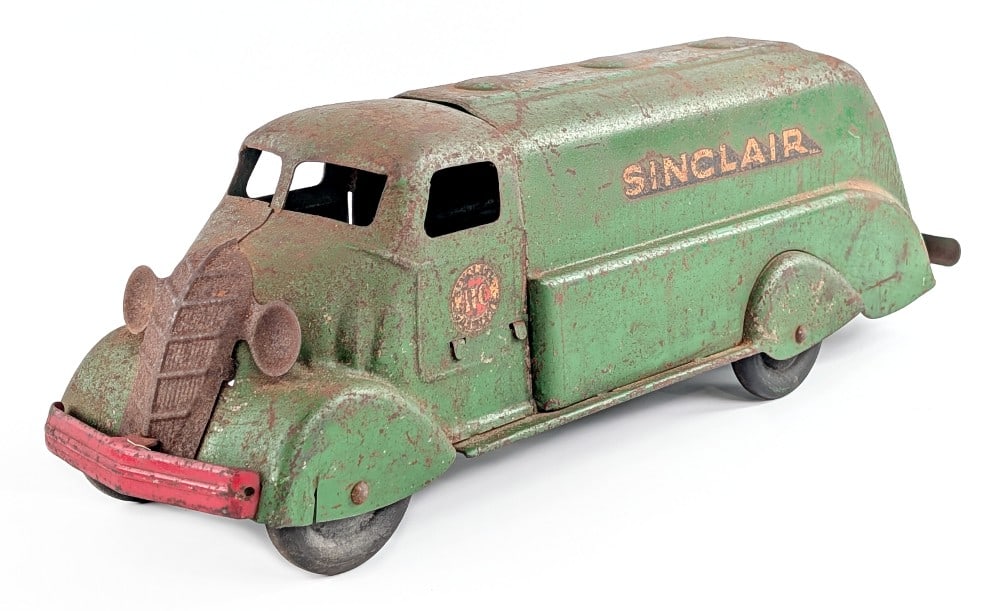 Marx Sinclair Tanker Truck: Original Marx Sinclair tanker truck. The truck has surface rust, paint loss, and decal loss from play and age. Measures approximately 18" long. *From the Gene Griser Collection*
