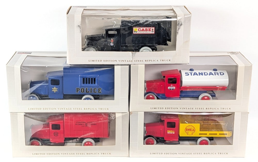 SpecCast Metalcraft Style Reproduction Trucks: SpecCast Metalcraft style reproduction trucks. Includes a Case, IHC, Shell, Police, and Standard tank truck. They come in the boxes but some have been displayed. The trucks are approximately 11" long.