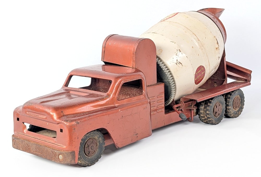 Structo Ready-Mix Concrete Mixer Truck: Original Structo Ready-Mix Concrete mixer truck. The truck has dents in the drum, surface rust, and wear from play and age. The truck is missing the grill. Measures approximately 20" long.