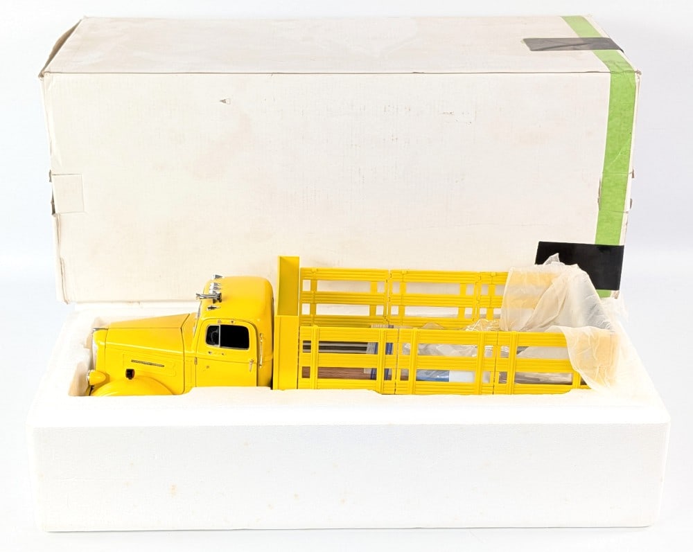 White WC-22 Stake Bed Truck: Fumby Street Motors White WC-22 stake bed truck. Mostly made of die-cast metal. A highly detailed replica. The mirrors are broke off, but it comes with replacements. It may be challenging to put them 