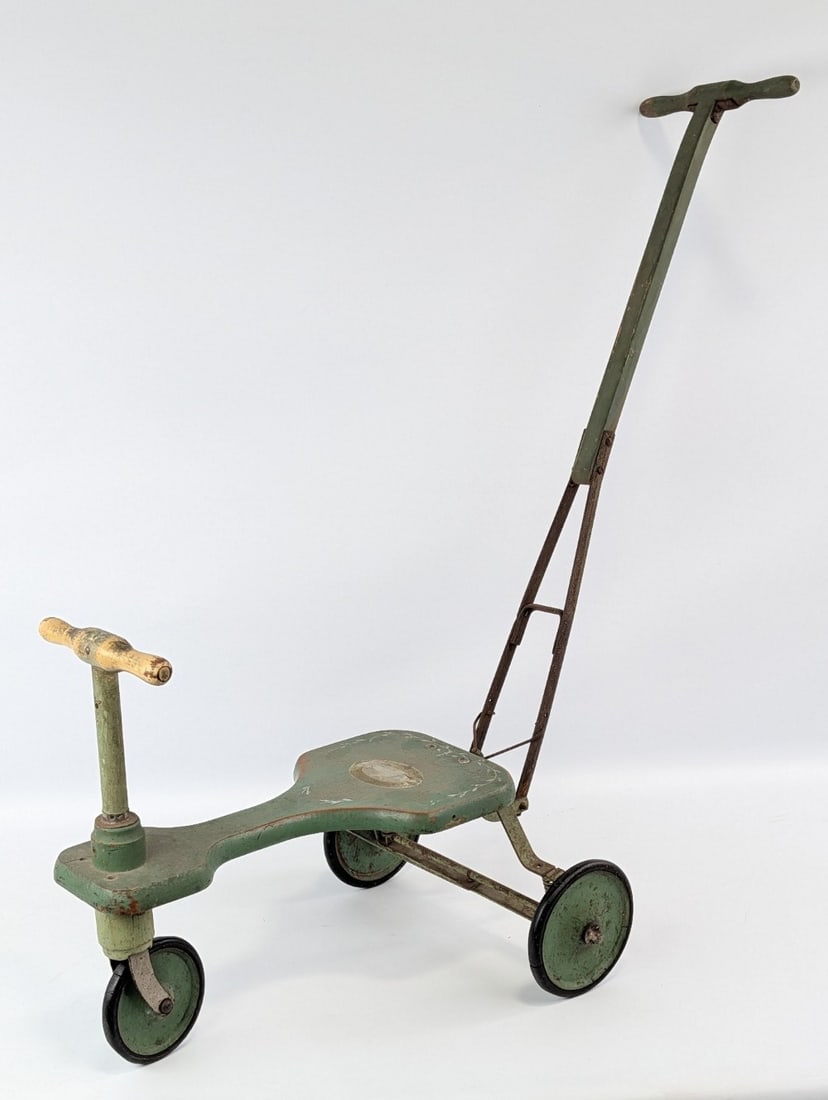 Early The White Company Child's Ride On Stroller: 1920's "The White Company child's ride on stroller tricycle. The tricycle has a handle for the child to steer and a handle for an adult to push. It has rear spring suspension. The original company dec