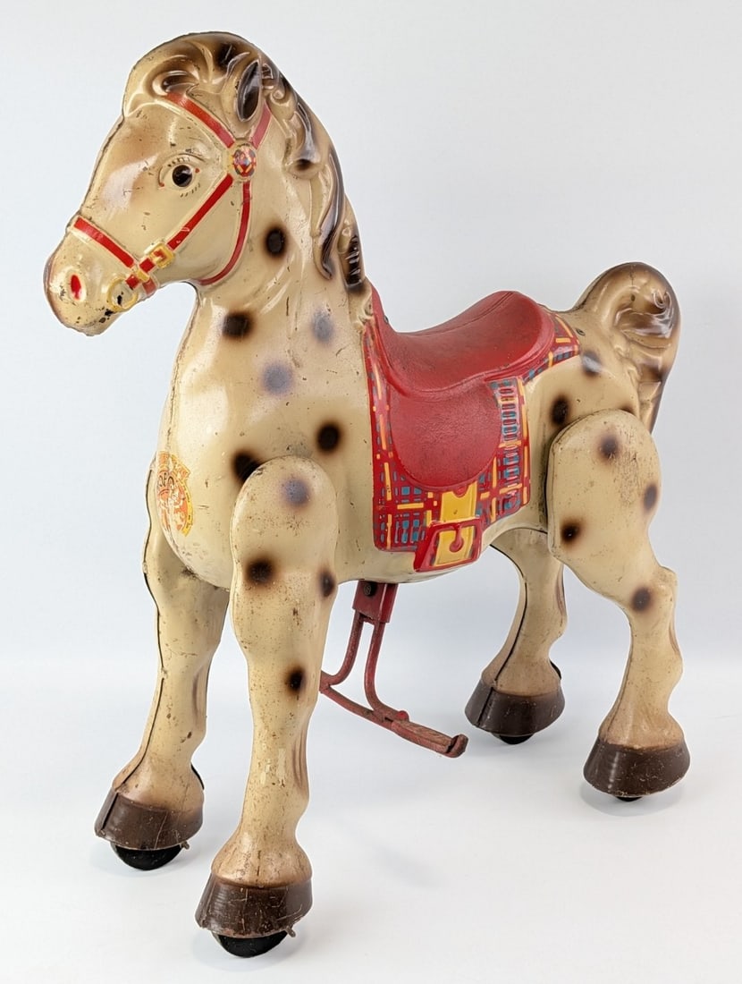 MOBO Bronco Ride On Horse: Vintage original MOBO Bronco ride on horse. Original condition with discoloration, paint loss, and wear from age. It is missing the reins. Measures approximately 25" long by 32" tall.