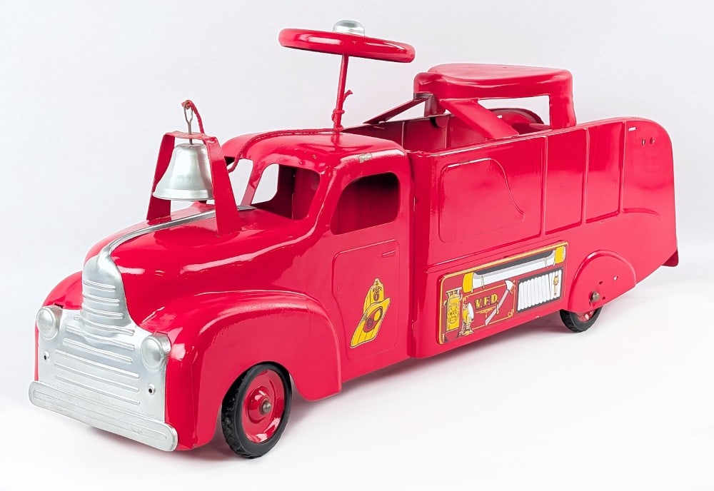 Marx Ride On Fire Truck: Marx ride on fire truck. The truck has been restored at some point in time. It does have some small paint chips and wear from use / age. The truck is missing the mounts for the replacement ladders. It