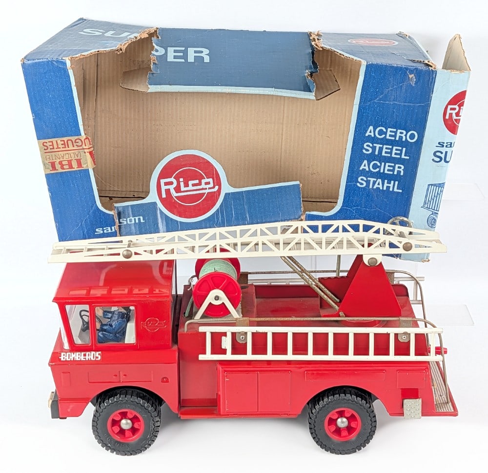 Super Sanson Aerial Ladder Fire Truck by Rico with Box: Vintage Super Sanson aerial ladder fire truck. Made by Rico in Spain. The truck is in very good condition except for the surface rust on the unpainted metal railing. The box has wear and tear from han