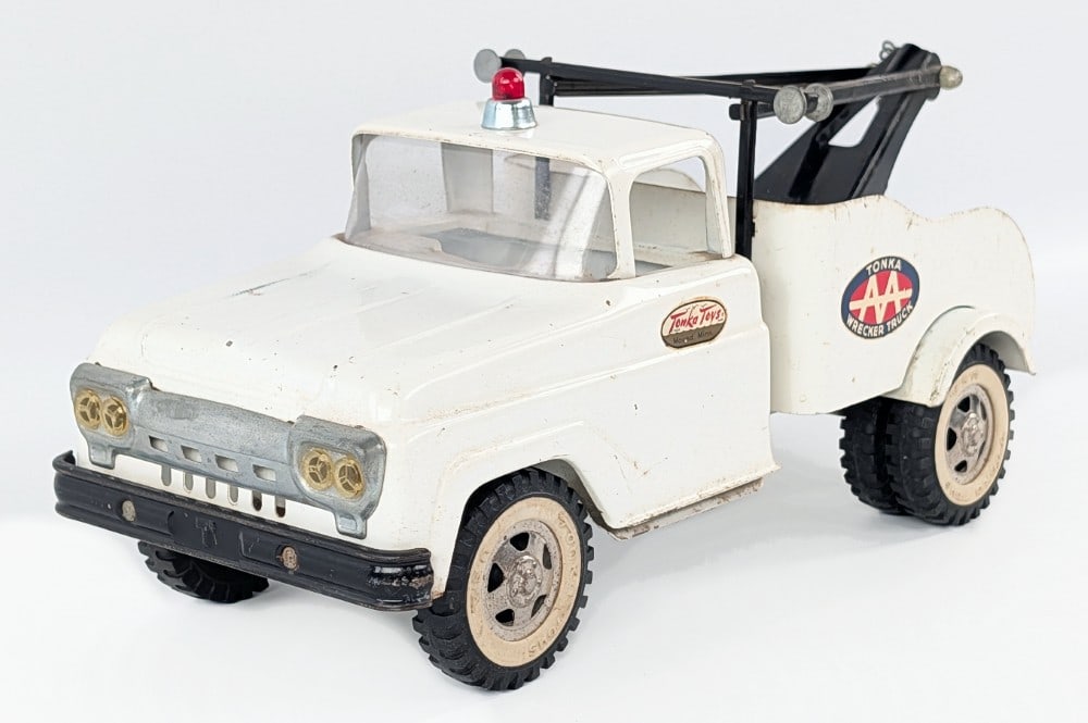 Tonka AA Wrecker Tow Truck: Original Tonka AA wrecker tow truck. Original condition with some paint loss and play wear. The siren may have been replaced. Measures approximatley 13" long.