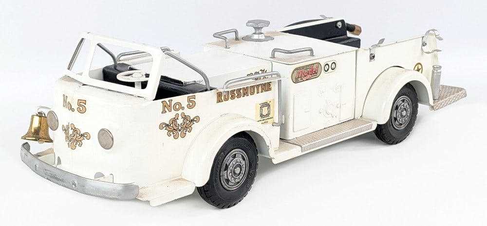 Doepke Rossmoyne Fire Truck - White: Doepke Rossmoyne fire truck. The truck was restored in white. An average restoration with some pitting / age wear showing. The truck is dusty from being on display and has some small paint chips. It i