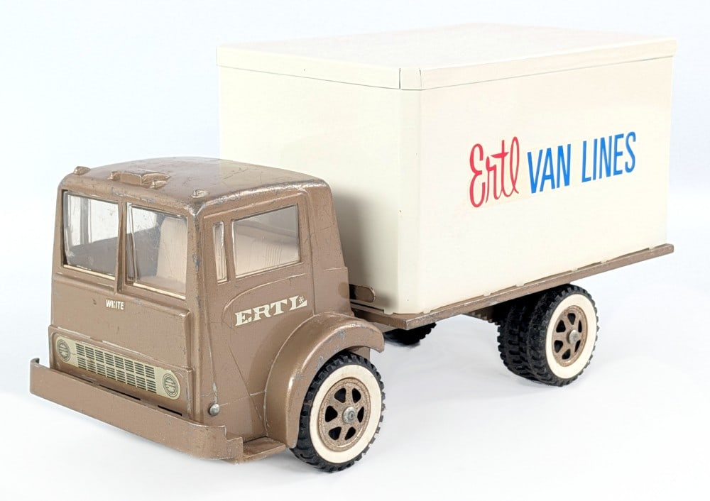 Partially Restored Ertl White Cabover Box Truck: Partially restored Ertl White cabover truck. The box van portion of the truck was restored. The truck itself shows paint loss and wear from play and age. The cab flips over to show the engine. Measure