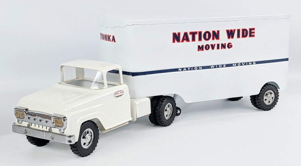 Custom Tonka Nation Wide Moving Truck and Trailer: Custom Tonka Nation Wide Moving truck and trailer. The truck has some discoloration, dust, and a small scratch on the hood from display. The trailer has a minor chip above the rear wheel and light