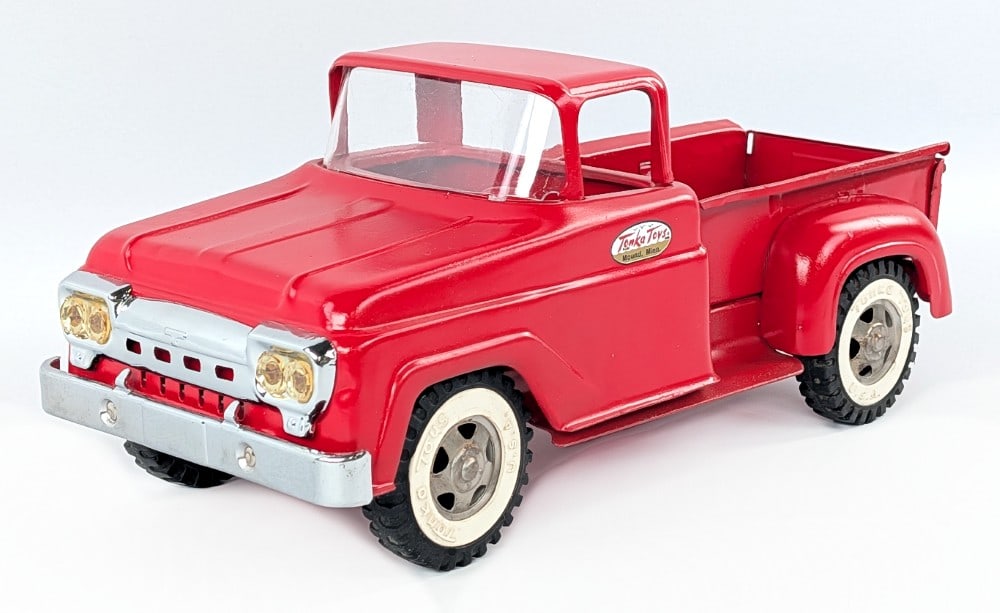 Restored Tonka Stepside Pickup Truck: Restored Tonka stepside pickup truck. The truck has a fair restoration with some roughness to the paint, but displays well with some new parts. Measures approximately 13" long
