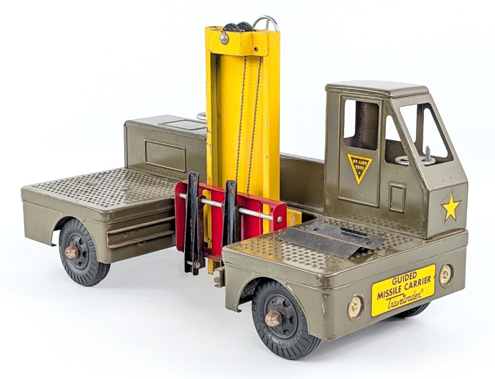 Original Nylint Guided Missile Carrier Truck: Original Nylint Guided Missile Carrier truck. The truck is missing the missile. The truck shows some light paint loss and play wear. Measures approximately 15-1/2" long.