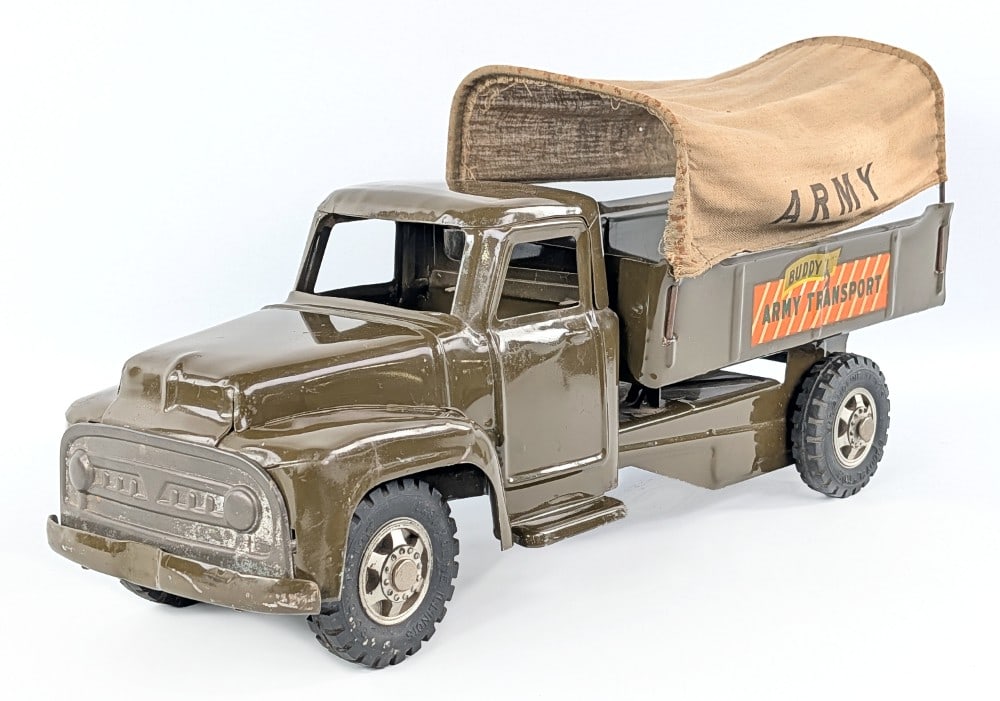 Original Buddy L Army Transport Truck: Original Buddy L Army Transport truck. The truck has some tiny holes in the canvas and light play wear. Overall a nice original truck. Measures approximately 20" long.