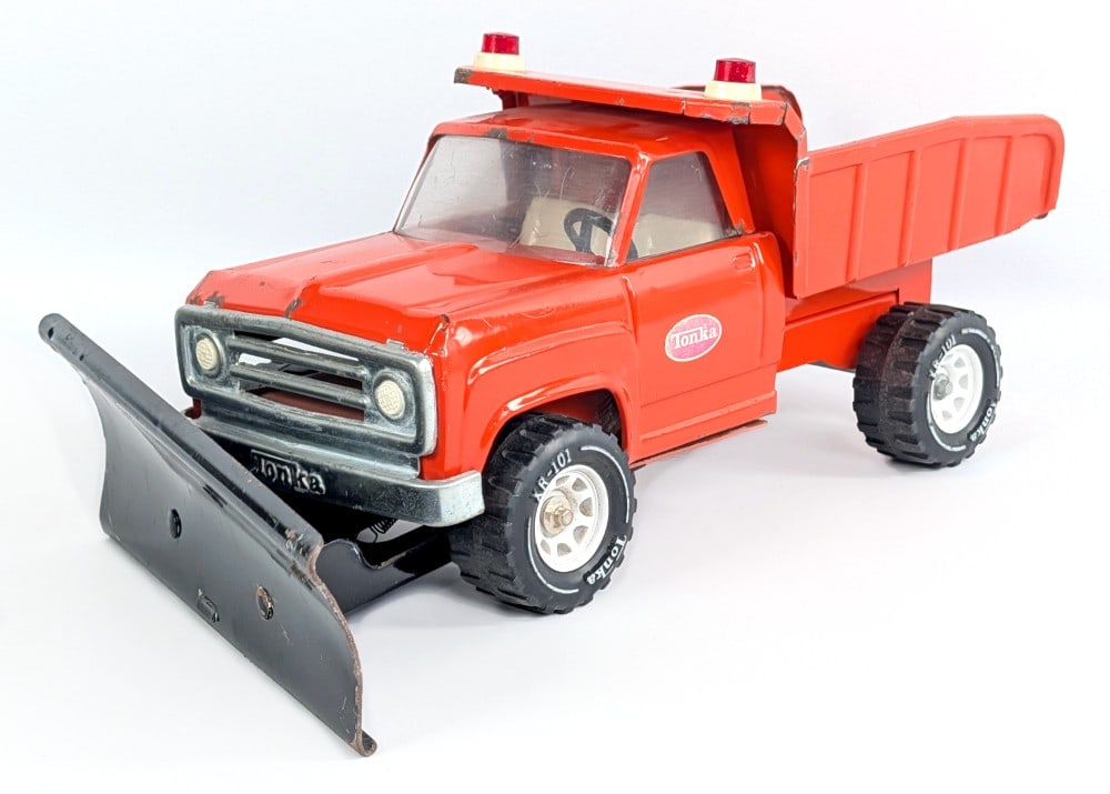 Original Tonka Dodge Dump Truck with Plow: Original Tonka Dodge dump truck with plow. The truck shows paint loss, discoloration to the decals, and wear from play and age. Measures approximately 15" long.