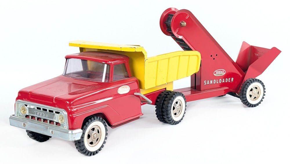Original Tonka Dump Truck w/ Sandloader: Original Tonka red and yellow dump truck with sand loader. The truck has decal discoloration, paint loss, and wear from play / age. Measures approximately 23" long overall.?