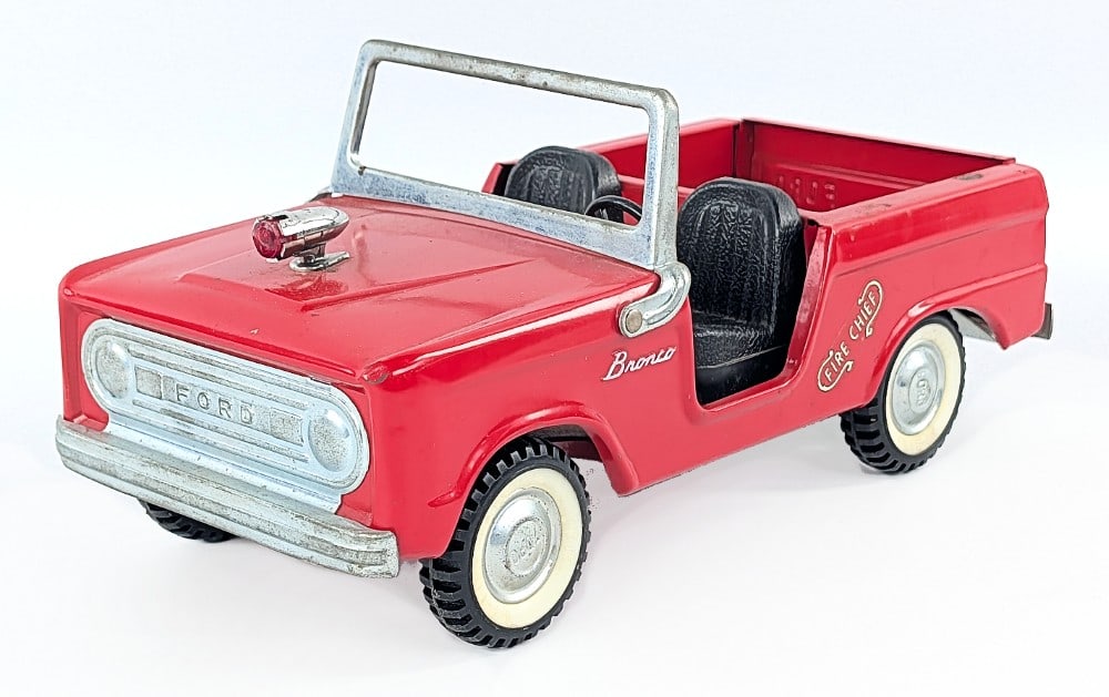 Original Nylint Ford Bronco Fire Chief Truck: Original Nylint Ford Bronco Fire Chief truck. The truck has some paint loss / surface rust in the bed, but otherwise is in good condition. Measures approximately 11" long.