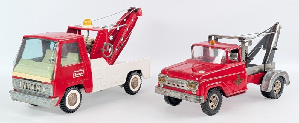 Buddy L & Tonka Wrecker Tow Trucks: Buddy L wrecker tow truck and custom Tonka wrecker tow truck. The Tonka was a fire truck that has a custom fabricated tow bed. The Tonka shows paint loss and wear from play and age. Each measures appr