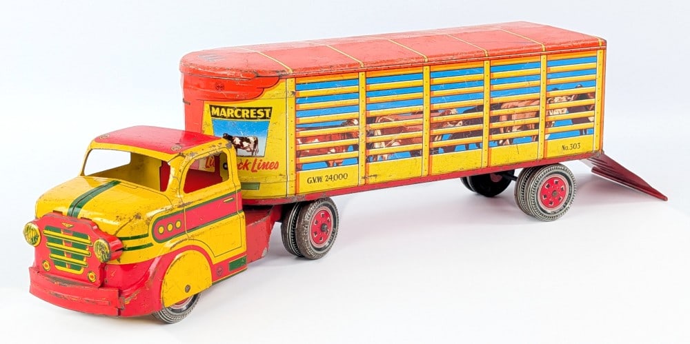 Marx Marcrest Livestock Lines Truck & Trailer: Marx Marcrest Livestock Lines truck and trailer. The truck is missing the plastic siren. The truck and trailer show paint loss and wear from play and age. Measures approximately 17" long.