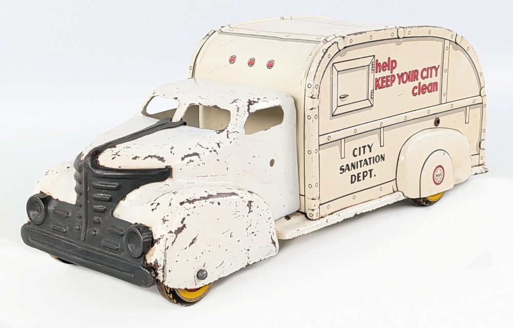Original Marx City Sanitation Dept. Garbage Truck: Original Marx City Sanitation Dept. garbage truck. The truck still has the rear door. It shows paint loss, scratches, and wear from play / age. Measures approximatley 13" long.