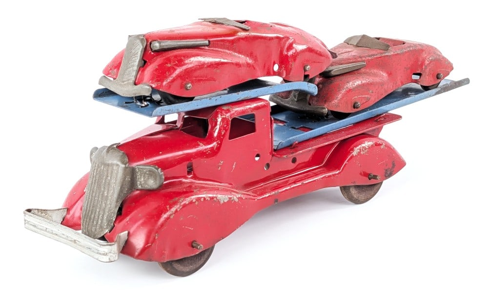 Marx Car Carrier Truck with Cars: Original Marx auto transport truck with two cars. Original condition showing paint loss and wear from play / age. Measures approximately 13-1/2" long.
