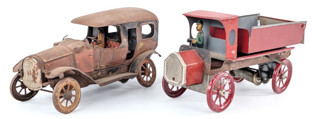 (2) German Tin Automobiles: (2) German tin automobiles. The limo is believed to be a Karl Bub. Both for parts / needing restoration condition. Sells as is. Each measures approximately 9-1/2" long.