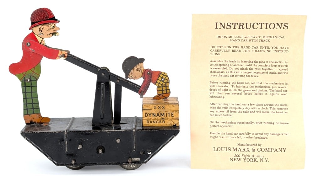 Marx Tin Windup Moon Mullins and Kayo Handcar: Marx tin windup Moon Mullins and Keyo handcar. Comes with the instructions paperwork. The windup mechanism somewhat works, but will need some adjustments. The toy shows scratches and wear from play /