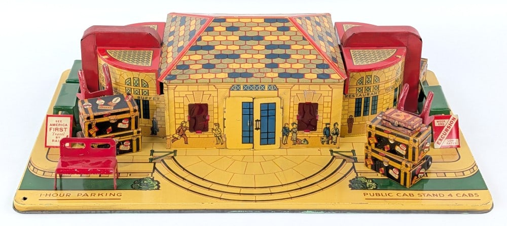 Marx Tin Litho Grand Central Station Railroad: Marx tin litho Grand Central Station Railroad with accessories. Original condition and displays well with great color and graphics. Some edge wear and minor loss. Measures approximately 17" across by 