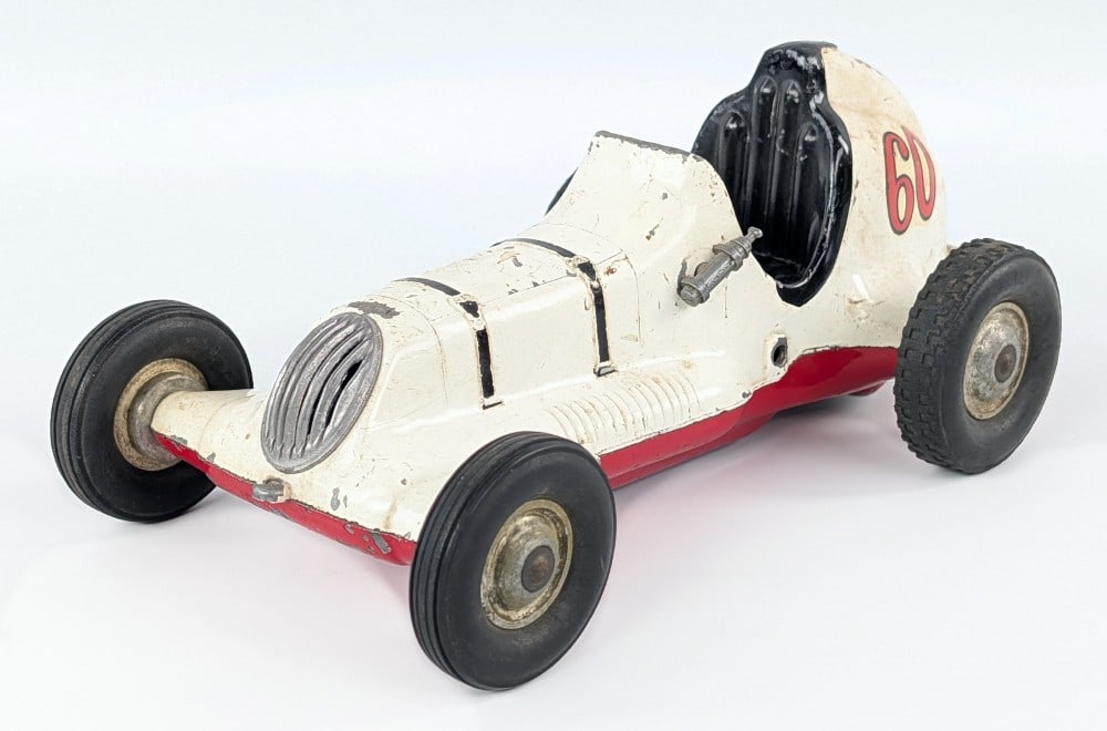 Roy Cox Thimble Drome Champion #60 Racer - White: Original Roy Cox Thimble Drome Champion #60 race car in white. The car has some paint loss and wear from play and age. It is missing the brake lever. Measures approximately 9-1/2" long.