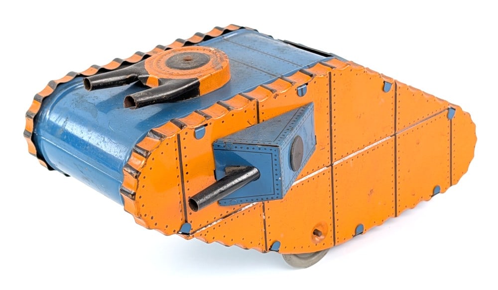 Marx Tin Windup Doughboy Tank - Orange: Marx tin windup doughboy military tank. Orange and blue version. All original and in working condition. Some minor loss from play and age. Displays very well overall. Measures approximately 9" long.