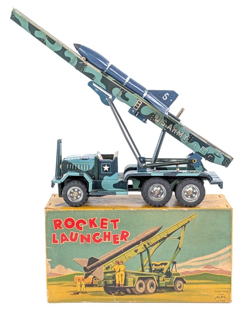 ALPS Japan Tin Friction Rocket Launcher Truck with Box: ALPS Japan tin friction rocket launcher truck with the original box. The truck has some minor scratches and dust from display. The box has some minor staining and a small chunk out of the one end. Ove